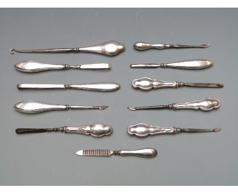 Eleven various early 20th century hallmarked silver dressing table and similar tools, length of longest 17.5cm