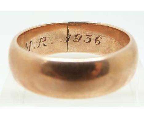 A 9ct rose gold wedding band dated 1936, 9.4g (size W)