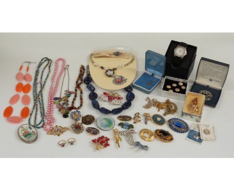 A collection of costume jewellery including 9ct gold crucifix and chain, silver necklace, brooches, etc