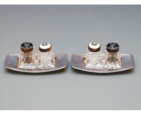 Pair of David Andersen enamel salts and peppers on bases, the guilloché enamel tops marked sterling 925 Norway, the trays bei