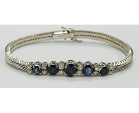 An 18ct white gold bracelet set with five graduated oval sapphires measuring approximately 0.65, 0.5, 0.5, 0.4 and 0.4ct and 