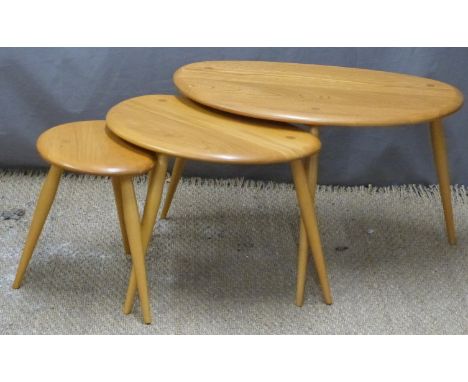 Nest of three Ercol pebble tables in light elm, width 65cm