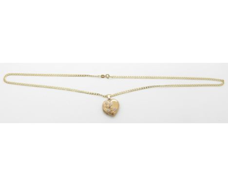 A 9ct gold chain/necklace and a yellow metal locket with floral decoration, 4.7g&nbsp;