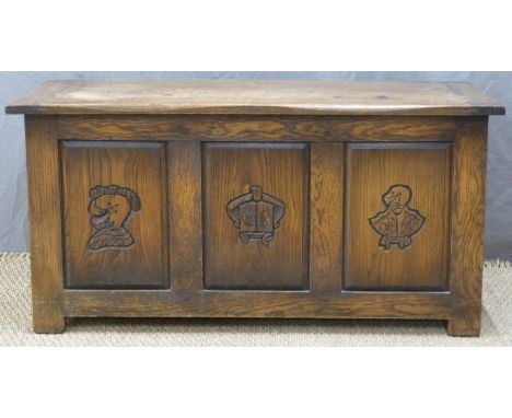 Oak three panel trunk with carved decoration, W108 x D40 x H53cm