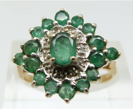 A 9ct gold ring set with emeralds and diamonds (size N)