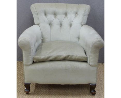 An upholstered button back tub chair raised on wooden legs and ceramic castors&nbsp;