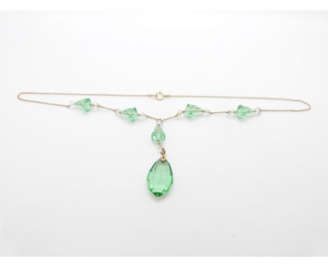 Art Deco 9ct gold necklace set with green and clear paste, 25.5cm drop