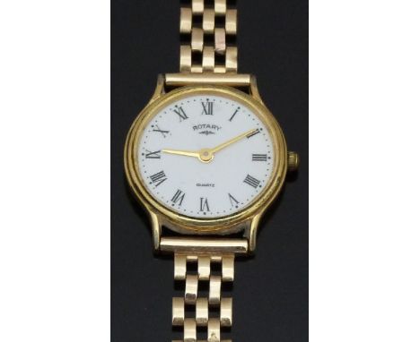 Rotary gold plated ladies wristwatch with gold hands, black Roman numerals, white dial, and quartz movement, on 9ct gold brac