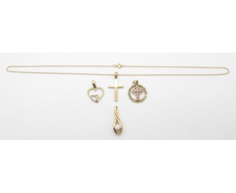 A 9ct gold heart pendant, 9ct gold Celtic cross pendant, 9ct gold cross on a 9ct gold chain (4.5g) and another pendant, 25.5c