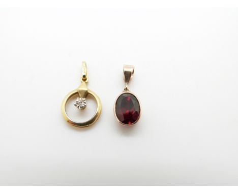 A 9ct gold pendant set with an oval garnet and a 9ct gold pendant set with a diamond, 2g