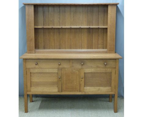 Heal &amp; Son London light oak Arts &amp; Crafts dresser or sideboard, having plate rack top with hanging pegs and boarded e