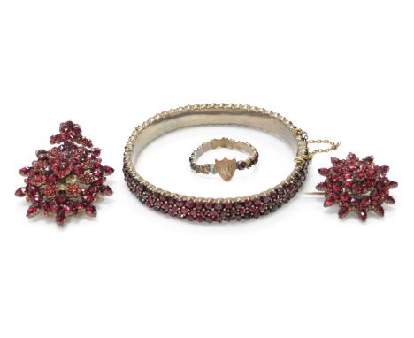 A suite of Victorian Bohemian garnet jewellery comprising brooch, pendant, bangle and ring&nbsp;
