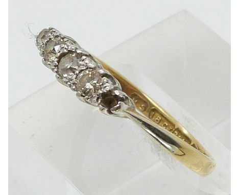 An 18ct gold ring set with diamonds in a platinum setting (size N)