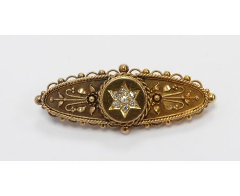 Edwardian 15ct gold brooch set with diamonds in a star and wire work detail, with glass compartment verso, Chester 1894&nbsp;