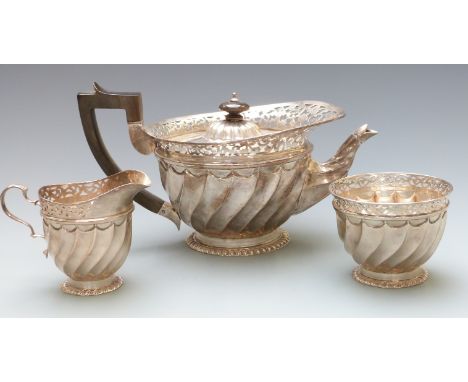 Victorian halmarked silver three piece tea set with wrythen and pierced decoration, teapot London 1894 maker James Wakeley &a