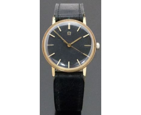 Omega gentleman's automatic wristwatch ref. 161.009 with gold hands and baton markers, black dial, gold plated case and signe