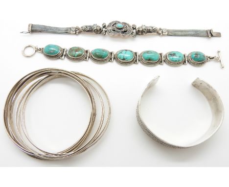 Silver bracelet made up of 8 interlinked bangles, silver bracelet set with turquoise, silver bangle and another silver bracel