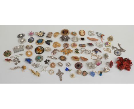 A collection of brooches including a DWH Scotland brooch, enamel brooches, Sarah Coventry brooch etc
