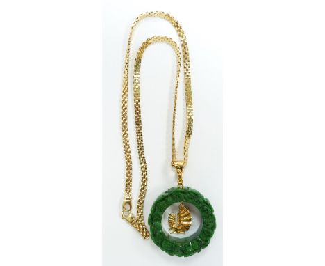 An 18ct gold necklace with a jadeite style pendant&nbsp;