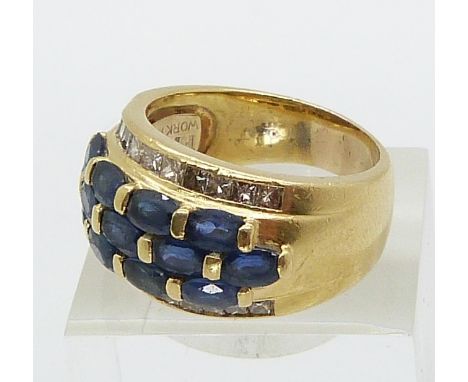 An 18ct gold ring set with 13 oval sapphires and 22 princess cut diamonds (size Q)