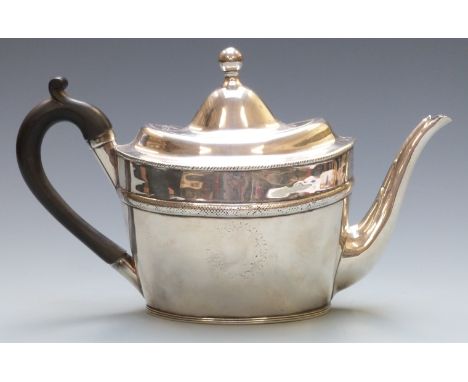 Georgian white metal teapot of oval form with engraved decoration, no visible silver marks but has been over polished, weight
