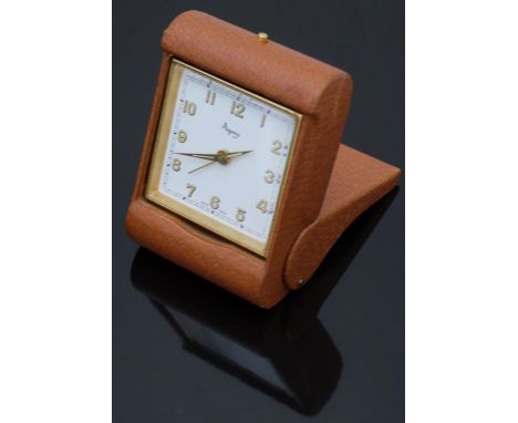 Asprey gold plated travelling alarm clock with gold and luminous hands, Arabic numerals, white dial and brown leather case/ s