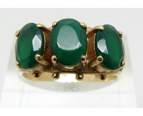 A 9ct gold ring set with green paste (size P)