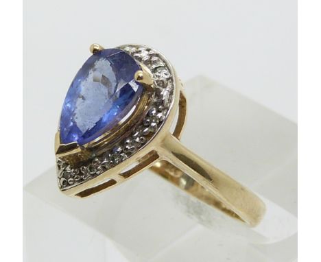 A 9ct gold ring set with a pear cut tanzanite and diamonds (size N)