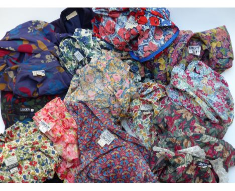 Approximately 11 vintage Liberty floral print dresses, similar skirt and a purple jacket