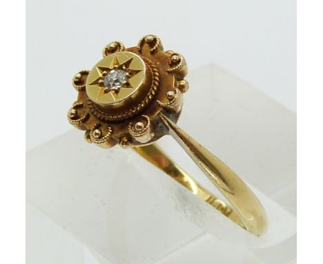 Victorian 18ct gold ring set with an old cut diamond in a star setting (size K)