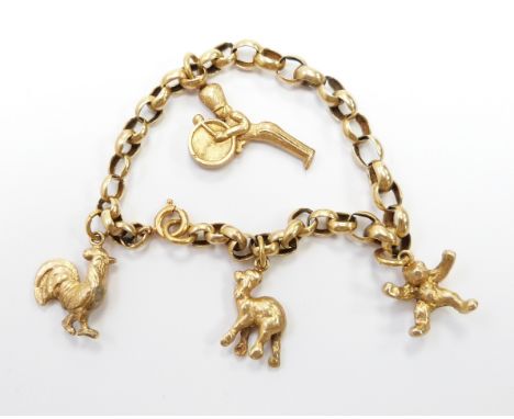 A yellow metal bracelet with gold plated charms&nbsp;