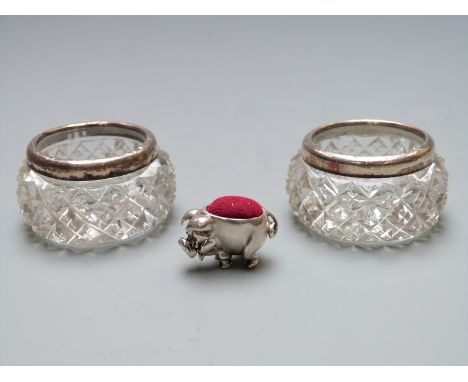 A pair of hallmarked silver mounted cut glass salts and a small novelty pig pin cushion marked 925