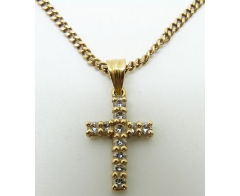 A yellow metal cross set with diamonds set with 11 round cut diamonds on a 9ct gold chain, 13.5g