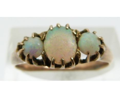 A 9ct gold ring set with three opal cabochons (size L)