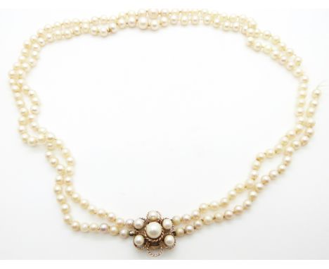 A double strand of cultured pearls with 9ct gold clasp