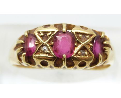 Victorian 18ct gold ring set with three rubies and four diamonds, Birmingham 1890 (size N)