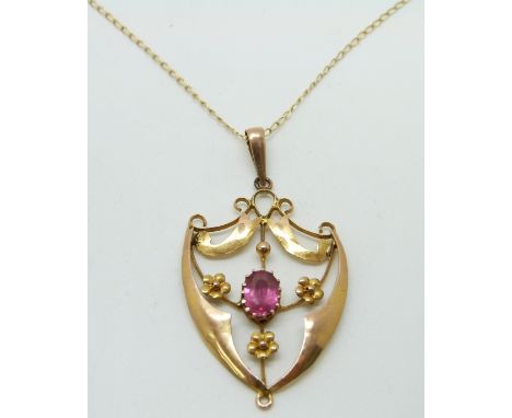 A 9ct gold pendant set with pink topaz on a 9ct gold chain, 2.7g