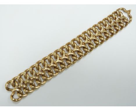 A 14k gold bracelet made up of interlocking links, 73.5g