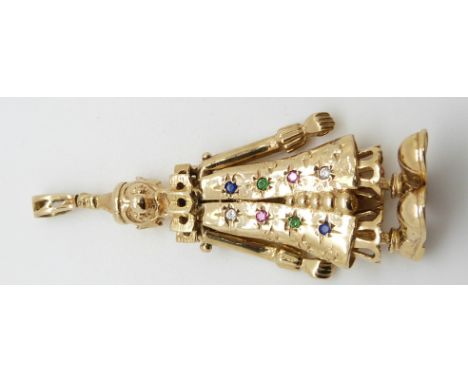 A 9ct gold pendant depicting a clown with moving arms and legs set with rubies, emeralds, cubic zirconia and blue stones, 18.