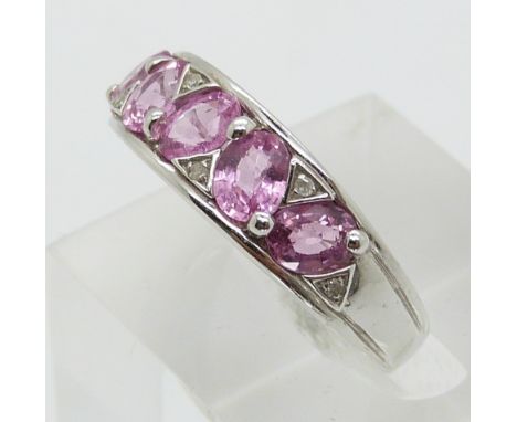 A 9ct white gold ring set with five oval cut pink sapphires and diamonds (size P)