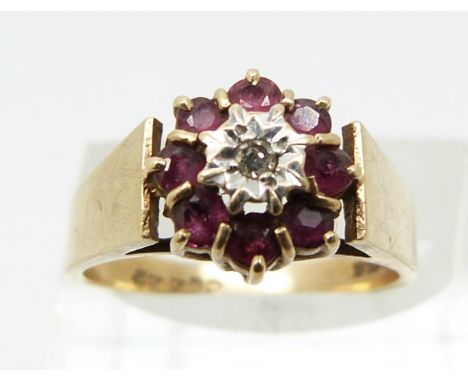 A 9ct gold ring set with rubies and a diamond (size N)