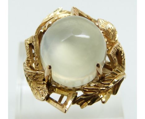 A 9ct gold ring set with a large moonstone cabochon (size R)