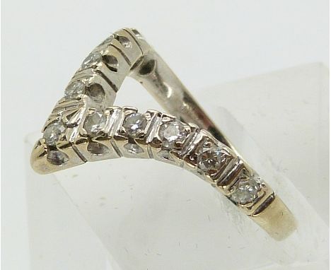 An 18ct white gold ring set with diamonds in a V shape (size I)