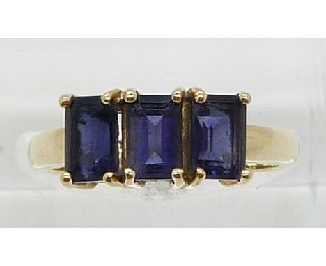 A 9ct gold ring set with three iolite (size N)