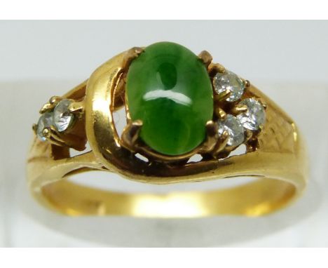 A yellow metal ring marked 18k set with faux jade and paste, 2.3g (size L)