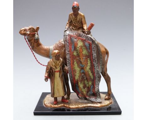 Bergman style cold painted table lighter formed as a carpet seller on a camel, height 18.5cm