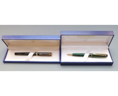 Boxed Waterman ballpoint pen with black shaft and gold plated fittings together with a similarly boxed green marble pen