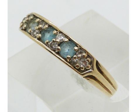 A 9ct gold ring set with topaz and diamonds (size P)