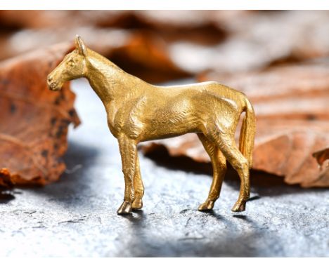 A 9ct gold brooch in the form of a horse, 12.1g