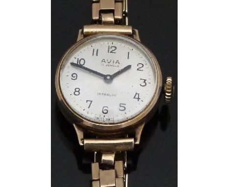 Avia 9ct gold ladies wristwatch with black hands and Arabic numerals, silver dial and 17 jewel calibre 6662 movement, on 9ct 